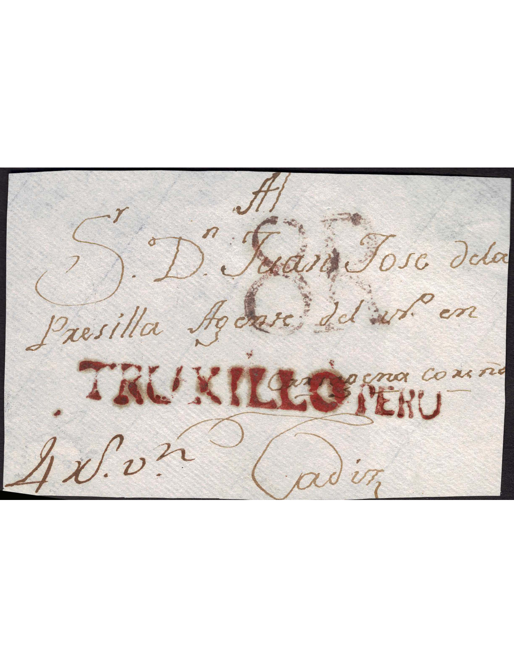 1815 circa Trujillo (Perú) a Cádiz. Frente de sobrescrito con las marcas de cuño en origen “TRUXILLO” y “PERÚ”, y de porte en de