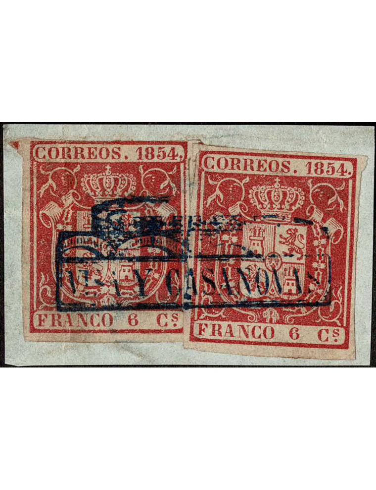 1854. 2 ejemplares de 6 cuartos carmín sobre pequeño fragmento que reproduce toda la marca “VISA Y CASANOVAS”. Pieza de gran luj