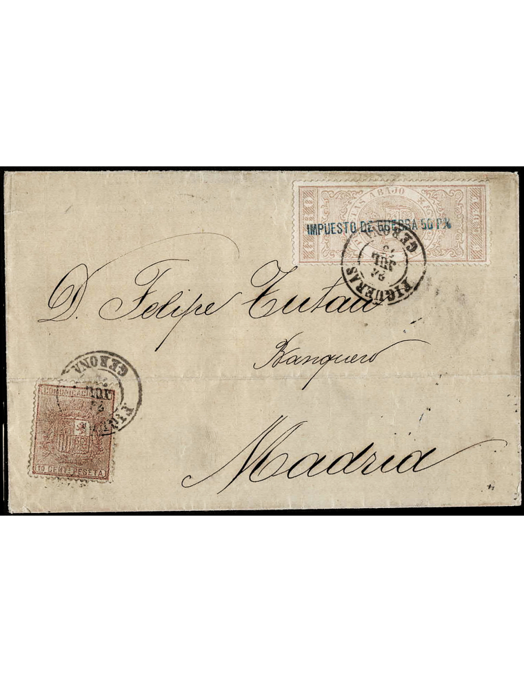 1875 (24 JUL) Figueras a Madrid. 10 cts. castaño y sello de Giro habilitado para Impuesto de Guerra mat. fechador en negro de Fi